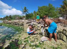 Kiribati residents build a seawall with blocks of reef to protect themselves against rising sea levels. Kiribati one of the countries most vulnerable to rising waters and other climate change effects, 2013